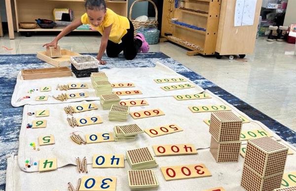 student doing montessori math